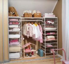 an organized closet with clothes and other items