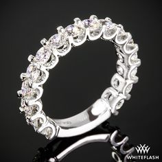 a white gold ring with diamonds on it