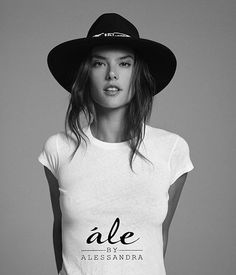 a woman wearing a hat and t - shirt with the words ale by alessandra on it