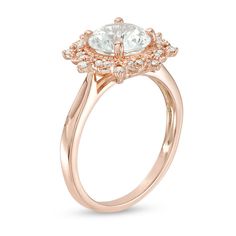 Striking and splendid, this vintage-inspired ring is a treasured keepsake in the making. Crafted in precious 10K rose gold, this pretty style showcases an 8.0mm lab-created shimmering white sapphire wrapped in a sculpted sunburst of sparkling petite diamonds and intricate milgrain detailing. Captivating with 1/6 ct. t.w. of diamonds and a bright polished shine, this design speaks to her elegant taste. This ring is available in size 7 only. Vintage Rose Gold Diamond Ring With Prong Setting, Victorian Rose Gold Round Diamond Ring, Heirloom 14k Rose Gold Jewelry With Prong Setting, Vintage Round Cut Jewelry With Halo Design, Vintage Rose Gold Rings With Prong Setting, Vintage Wedding Jewelry With Halo Design, Classic Rose Gold Jewelry With Center Stone, Heirloom Rose Gold Ring With Diamond Cut, Vintage Jewelry With Halo Design For Wedding