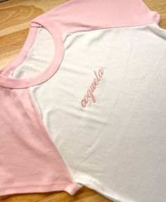 For all the girlies that love coquette... 🎀 A spanish version of the 'Coquette' saying! Size down if you like a tighter fit, size up if you like a looser fit. Embroidery is 4" in width. Material is slightly sheer. Model is wearing size L. PLEASE NOTE: This item is made to order. Please allow 3-9 business days as processing time for us to ship out your order. Baby Tee, Infant Tees, The Dreamers, Loose Fitting, Tights, Embroidery, How To Wear