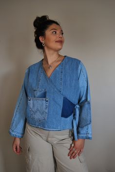 The Ruby Wrap Around is a stylish collarless denim jacket. This wrap around jacket has two side fastenings to create a kimono style finish.  When to wear? This lose fit tie jean jacket is the perfect extra layer, Swap that cardigan and don your Ruby Wrap Around.  Jacket sizing and details: one size, models are sizes 12-14(uk) can fit between 10-16 (uk) Chest/Bust 44" 112cm - Back length 20" 51cm - Sleeve 22" 56cm. Tie fastenings   *Every item at Reclaimed Roundabout is completely unique and one Wrap Top Outfit, Collarless Denim Jacket, Denim Tie, Upcycled Jeans, Upcycle Jeans, Wrap Jacket, Tie Wrap, Kimono Style, Kimono Fashion