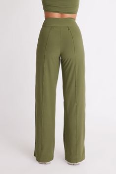 The Cut:When they said “she wears the pants,” these are the pants they meant. Made from recycled fabric in a brushed, vegan suede finish and featuring our signature figure-flattering high-waistband, these wide leg pants are an essential for the perfect capsule closet. Wear them to work and to your dinner date after. Featuring accent seams on the front and back and available in two inseams. Made using post-consumer recycled plastic — 84% RPET and 16% spandex. The Color:The results are in and gree Chic Olive Straight Leg Bottoms, Olive Wide Leg Pants For Fall, Chic Olive High-waisted Pants, Olive Pants With Elastic Waistband, Chic Olive High Waist Bottoms, Olive Wide Leg Pants With Elastic Waistband, Olive Wide Leg Relaxed Fit Pants, Olive Fitted Straight Leg Bottoms, Fitted Olive Straight Leg Bottoms