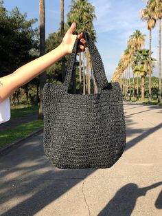 Any woman must have this bag for every fashionista.Whether you keeping it to yourself or gifting someone you care, it will be unforgettable. ✔️I made this beautiful bag from black natural paper rope which is organic cotton. ✔️The interior of the straw summer bag has a magnetic button. Suitable for use as shoulder bag, beach bag or party bag ✔️You can combine your clothes with a straw summer bag on summer days ✔️Handcrrafted in Turkey ✔️Hand-crocheted with care ✔️This bag is light weight yet dura Summer Handheld Bag With Large Capacity, Large Capacity Rectangular Canvas Bag For Vacation, Trendy Handheld Bucket Bag For Travel, Trendy Handheld Hobo Bag For Travel, Handheld Bags For Everyday Beach Use, Handheld Bag For Everyday Beach Use, Handheld Shoulder Bag For Beach Travel, Casual Handheld Canvas Bag For Vacation, Travel Handheld Shoulder Bag For Beach Season