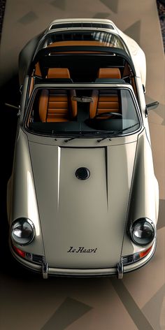 an old porsche type sports car is shown from above