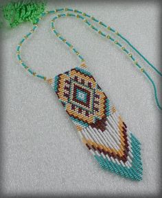 a beaded necklace with beads and an ornament