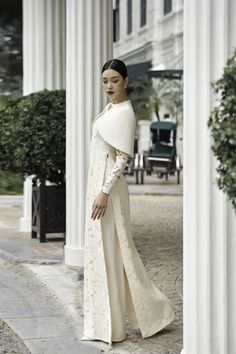 Rosaire Straight Long Sleeved Silk Lace Floor Length Ao Dai | MEAN BLVD Cape Outfit, Gowns Elegant, Lace Cape, Occasion Outfit, Wedding Backdrop Design, Types Of Lace, Traditional Outfit, Mean Blvd, Evening Gowns Elegant