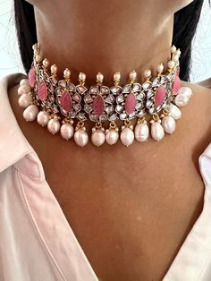 RESTOCKED ♥️ Be your own kind of beautiful. Simply a mark of royalty and elegance! You will definitely fall in love with the beautifully placed pink stones with Kundan Stone embellishments. One of our favourite picks for the wedding season 2021❤️ The pearl drops add a perfect glamour to the gorgeous piece. The pretty statement earrings add to the royalty of the stunning choker necklace. Length of earrings: 5 cms , push back closure The weight of the earrings is 16 g per pair. Indian Kundan Jewellery, Bridal Choker Set, Kundan Choker Set, Kundan Choker, Pink Stones, Bridal Choker, Choker Set, Earrings Wedding