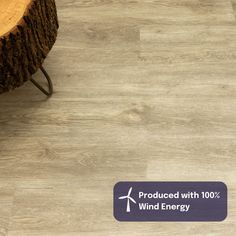 an image of a wood floor with the words product with 100 % wind energy on it