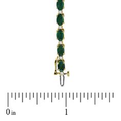 Dress her wrist in glamorous green emeralds and shimmering diamonds. Expertly crafted in warm 14K gold, this traditionally designed bracelet pairs 6.0 x 4.0mm oval-shaped verdant green emeralds with shimmering white diamonds to create a sparkling and colorful garland. An exceptional look, perfect with her most special attire, this bracelet captivates with 3/8 ct. t.w. of diamonds and a polished shine. The 7.0-inch bracelet secures with a durable box clasp. Green Oval Diamond Tennis Bracelet, Formal Oval Gold Bracelet With Diamond Accents, Oval Green Diamond Bracelets, Green Oval Diamond Bracelets, Classic Green Oval Diamond Bracelet, Luxury Green Oval Tennis Bracelet, Green Oval Diamond Bracelet For Anniversary, Elegant Green Oval Diamond Bracelet, Oval Emerald Bracelets For Anniversary