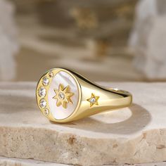 The crescent moon and star is one of our world's most ancient symbols, combining powerful icons joining man and woman. The star represents the female principle, and celebrates the cosmic powers of the love Goddesses Venus. This signet ring captivates us with its sparkling diamond and gold tone details. We love that it is bursting with celestial wonder!Carat Weight: 0.544 ctStone Size: 1.3,1.5,1.7,2.1,2.5 mmStone Type: Jeulia® StoneNumber of Stones: 9 Stone Shape: RoundStone Color: Diamond WhiteW Mystical Moon Phase Ring, Moon Phase Rings As Gifts, Celestial Open Ring Jewelry, Symbolic Sun And Moon Star Jewelry, Cosmic Powers, Star Jewellery, Moon Carving, Crescent Moon And Star, Mountain Ring