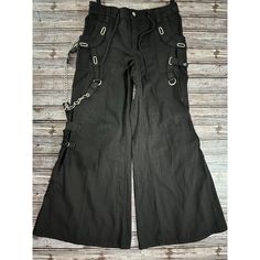 Tripp Nyc Cargo Wide Leg Pants Are Size 7, Boasting A Solid Pattern And Cotton Material. The Punk Rock Skater Style With 7 Studs By Daang Goodman Adds An Edgy Touch. Tripp Nyc Brand Black Color Size 7 Cargo Style Solid Pattern Cotton Material Punk Rock Skater Style 7 Studs Punk Style Wide Leg Bottoms For Concerts, Rock Style Bottoms For Spring Streetwear, Wide Leg Cotton Pants For Concert, Cotton Wide Leg Pants For Concert, Casual Wide Leg Pants For Concert, Punk Wide Leg Cargo Pants For Streetwear, Punk Style Pants With Pockets For Concerts, Punk Pants With Pockets For Concert, Punk Style Bottoms For Spring Concert