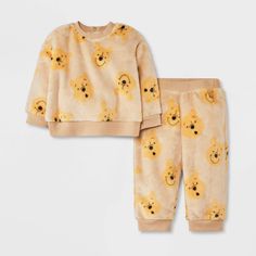 Your baby will stay cozy while looking so adorable dressed in the Disney Winnie the Pooh Cozy Fleece Pullover and Pants Set. Made from fleece fabric, this yellow sweatshirt and jogger pants set provides soft comfort and a snug fit with the ribbed cuffs and hem. The top comes with back snaps for ease of dressing and changing, while the pants feature a full elastic waistband to help keep them in place. Both the pieces are covered with allover Pooh face print for a look that's sure to delight. Winnie The Pooh Outfit, Newborn Boy Clothes, Grey Bodysuit, Christmas Pajama Set, Face Print, Yellow Sweatshirt, Top And Pants Set, Disney Winnie The Pooh, Short Sleeve Bodysuit