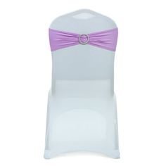 a white chair with a purple sash on it's back and the seat is empty