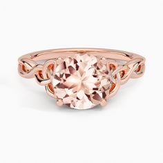 Morganite Celtic Love Knot Engagement Ring - 14K Rose Gold. The entwined lovers knot is a Celtic symbol of everlasting devotion with weaving strands of lustrous precious metal that wrap seemingly endlessly across the band. Elegant 14k Rose Gold Jewelry With Center Stone, Elegant Jewelry In 14k Rose Gold With Center Stone, Elegant Morganite Jewelry, Elegant Pink Gold Morganite Rings, Timeless Rose Gold Jewelry With Center Stone, Elegant Twisted Promise Rings, Timeless Morganite Rose Gold Jewelry, Elegant Yellow Gold Morganite Jewelry, Timeless Rose Gold Morganite Jewelry