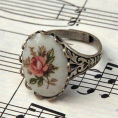 Vintage Pink Rose Cameo Ring Vintage Adjustable Cameo Rings, Vintage Rose Design Jewelry, Vintage Rose Design Jewelry In Rose Color, Vintage Oval Jewelry With Rose Design, Vintage Rose-colored Jewelry For Anniversary, Vintage Rose Jewelry For Anniversary, Vintage Oval Flower Ring, Antique Oval Flower Ring As A Gift, Antique Oval Flower Ring As Gift