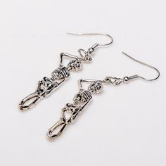 Elevate your gothic style with our Hang in There Earrings! Crafted from high-quality, hypoallergenic alloy, these 2.5-inch long earrings are designed to make a bold statement. Perfect for showcasing your unique taste, these earrings offer both style and comfort. Embrace your individuality and stand out with this stunning pair Trendy Silver Halloween Earrings, Edgy Pierced Metal Earrings, Trendy Metal Dangle Plug Earrings, Edgy Silver Drop Earrings, Trendy Pierced Earrings For Halloween, Edgy Metal Earrings With Ear Wire, Trendy Pierced Metal Plug Earrings, Trendy Halloween Dangle Earrings, Trendy Metal Pierced Plug Earrings