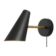 a black and gold wall light with an arm on the left side, and a white background