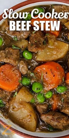 slow cooker beef stew in a bowl with peas and carrots