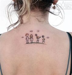 the back of a woman's neck with an image of three people on it