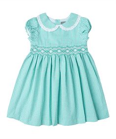 Style # PC-NP279 Made with 100% Cotton Summer Gingham Smocked Fitted Dress, Spring Gingham Smocked Dress With Short Sleeves, Short Sleeve Gingham Smock Dress, Short Sleeve Gingham Smocked Dress For Summer, Plaid Smocked Short Sleeve Dress, Gingham Short Sleeve Dress With Smocked Bodice, Gingham Dress With Smocked Back For Daywear, Short Sleeve Gingham Dress With Smocked Bodice, Gingham Dress With Smocked Bodice And Short Sleeves