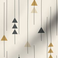 a white and gold wallpaper with trees on the back drop in grey, beige, and black