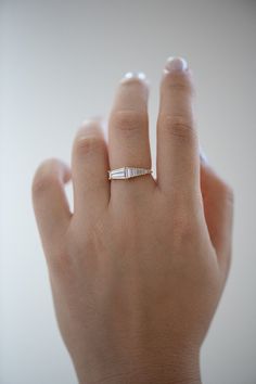 a woman's hand with a ring on it