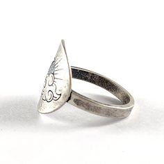 a close up of a ring with a cat on the front and back of it