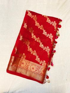 Showcasing a red colour Chiniya Silk saree, this saree is a masterpeice, hardwork of weavers are clearly visible in this, artistry of designer weaves to make the saree in checks pattern and fill it up with multicolour threads floral abstract,  This saree comes with a multiple colour contrasting Resham tassels.  Length: 6.5 mtr saree including 1mtr blouse peice Traditional Festive Slub Silk Pre-draped Saree, Art Silk Pre-draped Saree With Pallu For Rituals, Traditional Pre-draped Saree For Ceremonies, Festive Tussar Silk Pre-draped Saree With Traditional Patterns, Designer Handloom Pre-draped Saree For Festivals, Festive Semi-stitched Handloom Pre-draped Saree, Pre-draped Saree With Traditional Patterns For Ceremonies And Festivals, Traditional Handloom Pre-draped Saree For Diwali, Red Tussar Silk Pre-draped Saree With Motifs