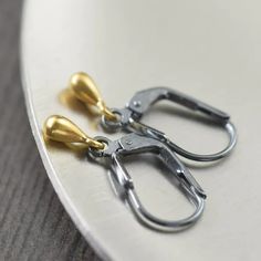 Sterling silver black and gold earrings. The gold vermeil teardrop charms dangle freely on lightweight blackened sterling silver lever back earwires. Black And Gold Earrings, Bali Earrings, Minimalist Gifts, Gold Alloys, Personalized Pendant, Silver Chain Bracelet, Handcrafted Earrings, The Gold