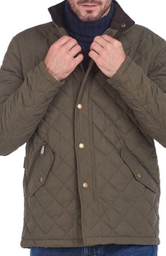 Quilted construction means rugged warmth and comfort in an outdoorsy jacket with timeless style. 30" length (size Medium) Front zip closure with snap storm placket Stand collar Front zip and snap-flap pockets Adjustable waist snap tabs Lined 100% polyester Machine wash, line dry Imported Men's Clothing Military Style Outdoor Outerwear With Padded Collar, Military Style Padded Collar Outerwear For Outdoor, Military Style Outerwear With Padded Collar For Outdoor, Military Outerwear With Padded Collar For Outdoor, Classic Utility Jacket With Padded Collar For Outdoor, Classic Quilted Outerwear For Outdoor, Winter Sport Coat With Buttons For Outdoor, Winter Hunting Outerwear With Flap Pockets, Khaki Outdoor Outerwear With Buttons