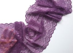 Violet purple color wide stretch lace with a floral pattern. The main background is matte. Flowers and leaves have a slight satin sheen. This stretch lace is perfect for lingerie/underwear, bra making, clothes, bags and accessories, dresses for dolls and kids, decorating home textiles - tablecloths, curtains, pillows, baby wiggames/teepees, gifts and other projects. Width: 9.05 inch = 23 cm Material: Polyamide, elastane Color: violet (purple) Price per 1 m = 1.09 yd More lace from Mintfroglace: Dresses For Dolls, Sewing Lace, Sewing Lingerie, Violet Purple, Babydoll Lingerie, Purple Lace, Stretch Lace, Baby Doll, Purple Color