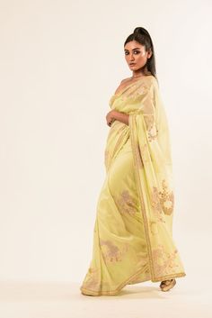 Discover our exquisite light-yellow crepe silk saree. Beautifully soft and detailed with intricate hand embroidery by skilled artisans, it adds elegant sophistication to any ensemble. Gold Silk Pre-draped Saree With Intricate Embroidery, Elegant Unstitched Yellow Blouse Piece, Gold Saree With Embroidered Border For Reception, Elegant Yellow Semi-stitched Pre-draped Saree, Pista Green Georgette Saree With Intricate Embroidery, Yellow Blouse Piece With Intricate Embroidery In Traditional Drape, Yellow Semi-stitched Elegant Blouse Piece, Pista Green Saree With Intricate Embroidery For Diwali, Yellow Saree With Intricate Embroidery For Eid