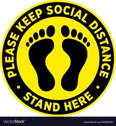 a yellow and black sticker with the words please keep social distance, stand here