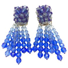 Here we have a seriously stunning pair of luxury vintage Coppola e Toppo earrings hand made by the duo during the 1950s. The earring tops are pave-embroidered with graduated blue crystal beads accented with interwoven deep blue crystal bugle beads. The tops would have been striking enough but it doesn't end there. A cascade of graduated tassels featuring graduated blue faceted crystal beads completes the earrings in spectacular style. The spectrum of the blues in these earrings is simply outstan Jennifer Gibson, Earring Tops, Blue Crystal Beads, Elsa Schiaparelli, Stylish Earring, The Duo, Bugle Beads, Vintage Jewels, Faceted Crystal