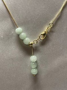 Natural Jade Bead Necklace . Simple design and nice looking. Material : Jade , Gold filled chain Jade Size: 6mmColor: Light Green Jade , Yellow gold filled & Silver color chain Chain Length: adjustable from 14 inches up to 16.5 inches. Packing : Nice silk Bag Ethereal Jewelry, Simple Jewellery, Jade Bead Necklace, Business Strategies, Silk Bag, Wire Ring, Bead Ideas, Pendent Necklace, Jade Necklace