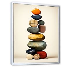 a stack of rocks sitting on top of each other in front of a white background