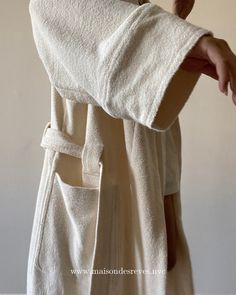 Full length robe made in our luscious, double sided terry. Lightweight and non restrictive, this organic knit has a stretch made for ultimate comfort. Belt stays secure without feeling restricted, sleeves stay rolled up, without feeling bulky. Made in organic cotton imported from Portugal, this double faced knit features a fast drying terry loop exterior and soft brushed interior. PRODUCT CODE: ROBE02/TF01.002 MORE DETAILS 100% ORGANIC COTTON DOUBLE FACE BRUSHED/TERRY LOOP TONAL MONOGRAM EMBROID Cozy Cotton Robe For Loungewear, Cozy Relaxed-fit Robe For Daywear, Cotton Robe For Lounging With Relaxed Fit, Cotton Robe With Relaxed Fit For Lounging, Relaxed Fit Cotton Robe For Lounging, Long Sleeve Cotton Robe For Loungewear, Cozy Robe With Relaxed Fit For Loungewear, Cozy Relaxed Fit Robe For Loungewear, Oversized Fall Robe For Loungewear