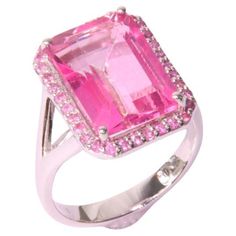 Orloff of Denmark; Pink Topaz and Sapphire Ring fashioned out of 925 Sterling Silver. This alluring ring is centered around a 9-carat pink topaz, cut in a bold emerald style that highlights its striking clarity and vibrant pink hue. The topaz is beautifully complemented by a halo of delicate pink sapphires, enhancing its bright color and adding to the ring's sparkle. Both the topaz and sapphires are set in polished sterling silver, whose subtle sheen ensures that the gemstones truly stand out. T Luxury Pink Topaz Ring With Prong Setting, Emerald Style, Jewelry Set Design, Sparkling Rings, Pink Topaz, Sapphire Stone, Pink Stone, Pink Sapphire, Cocktail Rings