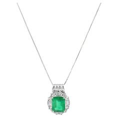 Item #509 GRS (Gem Research Swiss Lab) Certified Platinum & 18K ladies necklace with 3.25 carat of Colombian Emerald center stone (faceted octagonal shape) surrounded by .97 carat of round brilliant and baguette cut Diamonds supported by 18k Gold Chain. Emerald Weight: 3.25ct Shape: Octagonal The emerald-cut emerald at the center of this Pedant is certified by the Gem Research Swiss Lab as being Colombian in origin, and it displays the "Old Mine" green hue associated with gems from that region. 18k Gold Chain, Diamond Free, Contemporary Pendant, Colombian Emeralds, Diamond Cross Pendants, Emerald Pendant, Baguette Cut Diamond, Emerald Stone, Star Jewelry