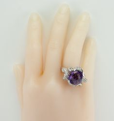 Genuine Diamond Ring, Amethyst Ring, Purple Ring, 18K White Gold Ring, Cocktail Ring, Moving Parts, February Birthstone, Unique Ring. This amazing large ring is crafted in solid 18K White Gold. The center natural checkerboard cut Amethyst measures 15mm x 13mm = 10.28ct. This is a very clean gem of great intensity. The ring is studded with natural diamonds. The grand total for all diamonds is 2.58 carat (carat weight is stamped inside of the band). There are white diamonds grading from VS1 to SI1 Formal Multi-stone Amethyst Ring With Round Cut, Elegant Multi-stone Amethyst Collectible Ring, Purple Ring, Amethyst Flower, Ring Purple, Purple Rings, Chocolate Diamonds, Gold Cocktail, Amethyst Gem