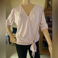 Nwt This Veronica M Three-Quarter Length Sleeve Top Has Wrap Front That Is Tacked At The V And A Banded Drop Waist Line With A Large Tie Bow. Versatile Purple Top For Spring, Stretch Mauve Tops For Spring, Spring Stretch Mauve Tops, Spring Lavender V-neck Top, Lavender Fitted V-neck Tops, Fitted Lavender V-neck Blouse, Chic Mauve V-neck Top, Elegant Lavender Tops For Spring, Elegant Mauve Tops For Spring