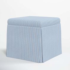 a blue and white striped ottoman cover