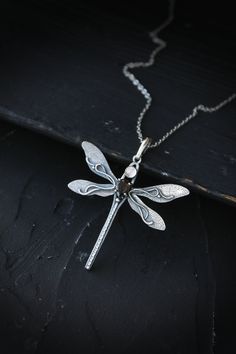 ITEM DESCRIPTION: The size of the pendant - H5 х W5 cm (2 x 2 inches), weight 4 g. I made this elegant dragonfly pendant of sterling silver, smoky quartz, and rose quartz. There are a beautiful natural texture and wire weave on the wings. And this is especially attractive. The pendant is made of high quality and skillful. Silver dragonfly will be a great complement to your jewelry collection or a gift to someone you love. Ooak jewelry made by eco-friendly materials. This handmade necklace will c Elegant Silver Dragonfly Jewelry, Elegant Sterling Silver Dragonfly Jewelry, Elegant Sterling Silver Dragonfly Necklace, Ursula Jewelry, Insect Necklace, Shark Necklace, Animal Pendant, Dragonfly Charm, Dragonfly Earrings