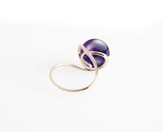 "[Ring] Lyra (purple version) [Metal Purity] 14 Karat solid yellow gold [Gemstone] Amethyst [Gem Type] Natural; non-treated / enhance [Dimension] H10mm x W20mm [Ring Size] Please select your size in \"Ring Size\" option. All sizes available. You can also select other karat gold color too. \"Perfection is achieved not when there is nothing more to add, but when there is nothing left to take away\". \"Lyra\", the ring of sheer elegance, it harmonize your formal outfits and great for a causal look. Elegant Amethyst Birthstone Crystal Ring, Elegant Yellow Gold Amethyst Open Ring, Elegant Purple Birthstone Ring, Elegant Amethyst Birthstone Ring With Round Stone, Fine Jewelry Yellow Gold Amethyst Open Ring, Elegant Amethyst Birthstone Ring For Formal Occasions, Fine Jewelry Open Amethyst Ring For Formal Occasions, Modern Yellow Gold Amethyst Ring For Wedding, Modern Yellow Gold Amethyst Wedding Ring