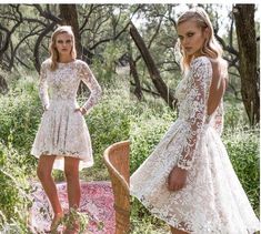 two women in white dresses standing next to each other and one is wearing a lace dress