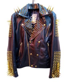 Long Golden Spiked Black Leather Jacket, Studded leather jacket, punk Style Leather jacket, Studded Biker Jacket, Brass Studded Jacket, Biker Studded Leather Jacket For Mens, Handmade Leather Jacket, Real Leather Jacket, Steam Punk Style Descriptions: 100% Real Cowhide Leather Fully Studded Jacket Handmade Studded YKK Zip Men's Wear Biker Jacket With Spikes And Long Sleeves, Biker Jacket With Spikes, Long Sleeve Biker Jacket With Spikes, Spiked Long Sleeve Leather Jacket For Biker Events, Edgy Spiked Winter Biker Jacket, Fall Rock Style Leather Jacket With Spikes, Long Sleeve Biker Jacket With Spikes For Biker Events, Edgy Winter Biker Jacket With Spikes, Spiked Leather Jacket For Biker Events