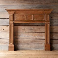 an old fireplace with wood paneling in a room