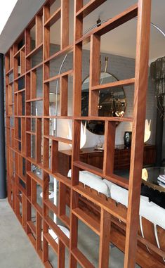 a large wooden book shelf with lots of books on it's sides and shelves