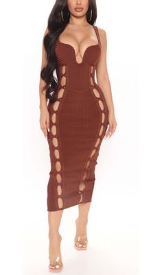 a woman wearing a brown dress with cut outs